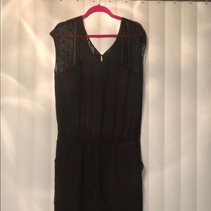 Black pant jumpsuit with lace top and slit
